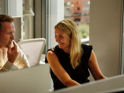 Two people talking in an office
